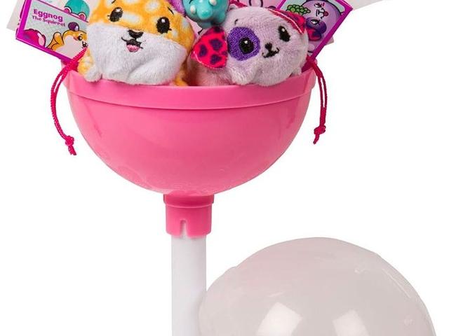 An opened Pikmi Pops lollipop on its stand with the mini plush inside